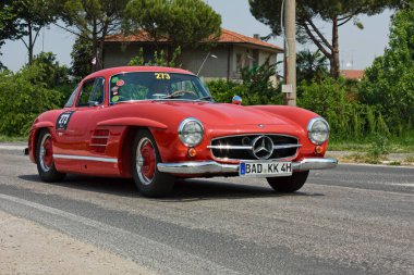 Vintage Mercedes-Benz 300 SL Coupe W198 (1955) in classic car race Mille Miglia, on May 13, 2011 in Forli, Italy clipart