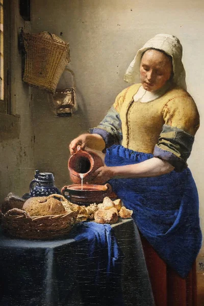 荷兰阿姆斯特丹Rijksmuseum的荷兰画家Johannes Vermeer的油画 挤奶女 实际上是一幅家庭厨房女佣的油画 免版税图库图片
