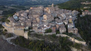 Aerial view over the old town of Montedinove, provinice of Ascoli Piceno, Marche region, Italy clipart