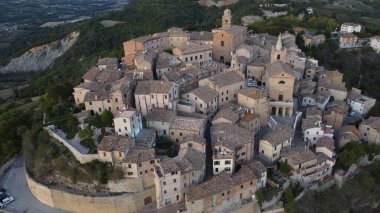 Aerial view over the old town of Montedinove, provinice of Ascoli Piceno, Marche region, Italy clipart