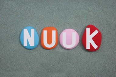 Nuuk,  capital of and most populous city in Greenland, an autonomous territory in the Kingdom of Denmark, creative logo composed with hand painted colored stone letters over green sand clipart