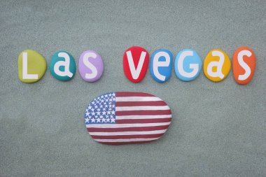 Las Vegas, creative souvenir composed with multi colored hand painted stone letters and USA flag over green sand clipart