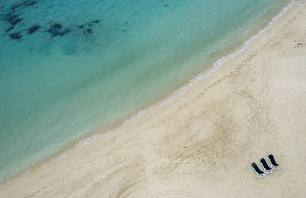 stock image Sea landscape empty beach with turquoise water with copy space for text. Beach chairs on beach. Seascape of Sand beach aerial drone shot