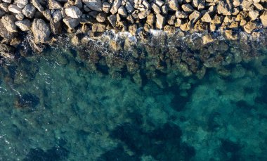 Top view of rocky ocean underwater surface. Calm water. Nature background