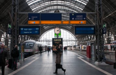 Frankfurt, Germany, January 14 2015: Passengers at the platforms of the main train travel station platform , Hauptbahnhof, of Frankfurt city in Germany