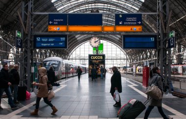 Frankfurt, Germany, January 14 2015: Passengers at the platforms of the main train travel station platform , Hauptbahnhof, of Frankfurt city in Germany