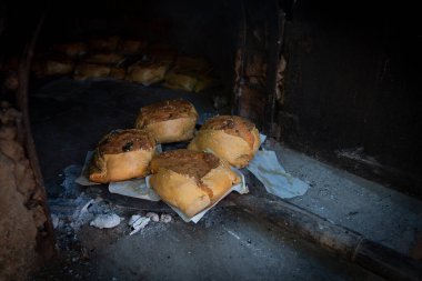 Traditional cypriot easter delicious fresh cooked cheese pastries on a clay oven. Flaounes pies and are made with various cheese.
