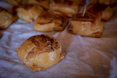 Traditional cypriot easter delicious fresh cooked cheese pastries on a clay oven. Flaounes pies and are made with various cheese.