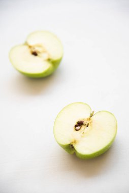 Slice of fresh apple green fruit on a white background. Healthy eating and nutritious food