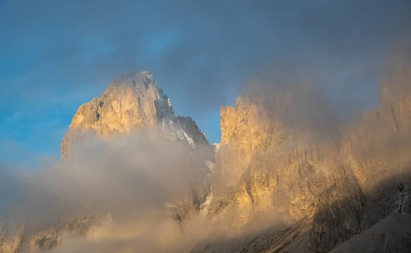 Foggy mountain landscape of the picturesque Dolomites at Passo Sella area in South Tyrol in Italy.