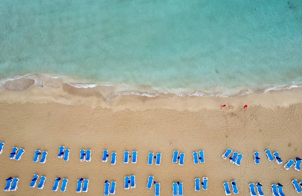 stock image Drone aerial of beach chairs in a tropical sandy beach. Summer holidays vacations in the sea. Protaras Cyprus Europe.