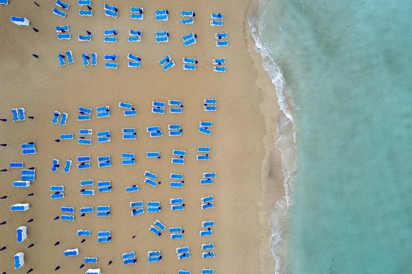 stock image Drone aerial of beach chairs in a tropical sandy beach. Summer holidays in the sea. Protaras Cyprus Europe.