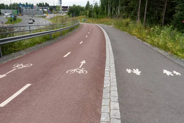 stock image Bicycle lane and pedestrian land road sign markings.