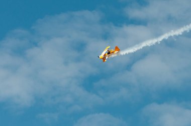 Airplanes performing aerobatics on the air during the Athens Flying week clipart