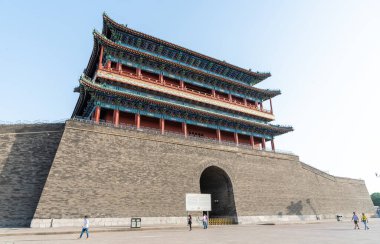 Beijing, China, June 4 2018: Tourists walking near the zhengyangmen gate, a magnificent structure forming part of the ancient city wall of beijing clipart