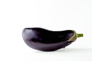 Fresh sliced aubergine (eggplant) on white background