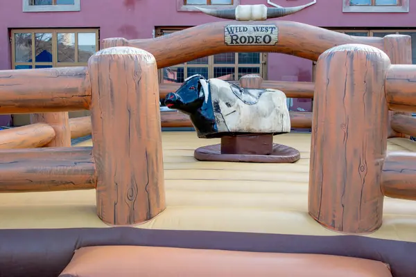Large Wooden Rodeo Mechanical Bull Riding Machine Stock Photo