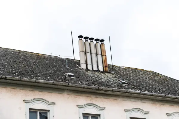 Close-up view of chimneys on the rooftops