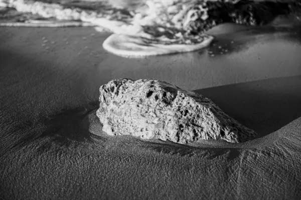 stock image sea, waves, beach, sand and stone at sunset time. black and white photo