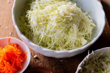 grated white cabbage and carrots and salt. Fermenting cabbage clipart