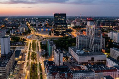 Aerial drone photo of Katowice centre with roundabout and modern office towers at evening. Katowice, Silesia, Poland clipart