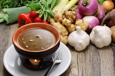 Bagna cauda(Italian Piedmont cuisine)is a hot dip made from garlic and anchovies. The dish is served with raw or cooked vegetables typically used to dip into it.