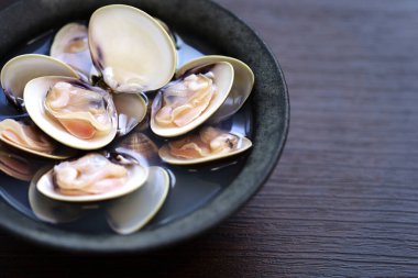steamed Hamaguri clams with Japanese rice wine (sake). clipart