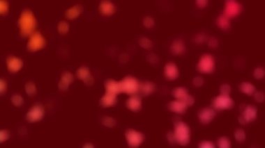 Küçük kırmızı nesnelerin çoğalıp hareketlerini bulanıklaştıran bir arka plan videosu (virüsler, bakteriler, patojenler veya hücreler gibi). Kusursuz döngü.