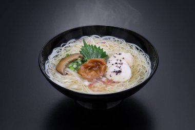 Nyumen, Boiled somen (Thin noodles made from flour. Sold in dried form ) poured with hot noodle soup base. Japanese cuisine. clipart