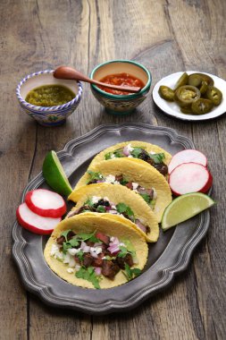 Carne asada tacos with salsa verde and roja, Mexico food