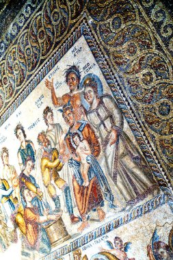 PAPHOS, CYPRUS - January 29 2023: Mosaic in Kato district, Paphos, Cyprus. Floor tile pattern inside ruined House of Theseus. Ancient Greek ornament of home interior in old Paphos city. Small stone textured surface. This site is an UNESCO World Herit