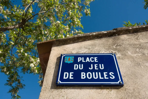 Street sign in French village at a square (in French: place) where people play jeu de boules