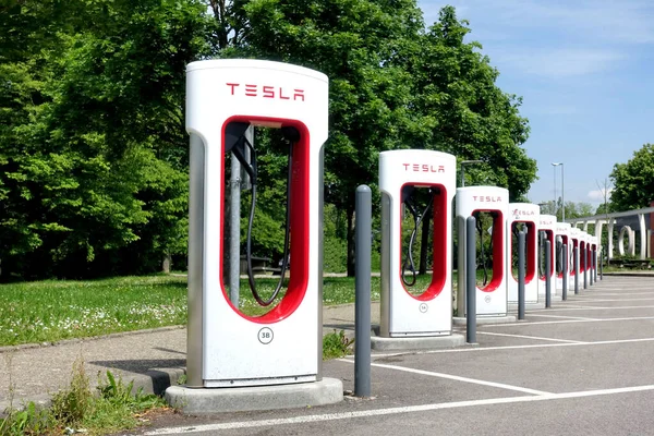 Stock image HAUCONCOURT, FRANCE - MAY,19,2023: Tesla Supercharger Station for electric cars. Tesla is an American electric vehicle and clean energy company based in Palo Alto, California                         