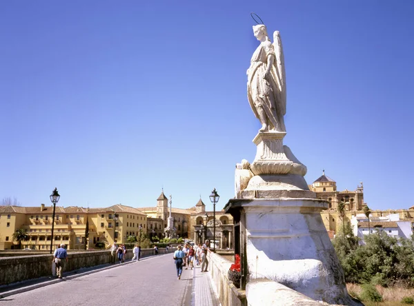 Archangel raphael statue on the Roman bridge at Cordoba Spain.