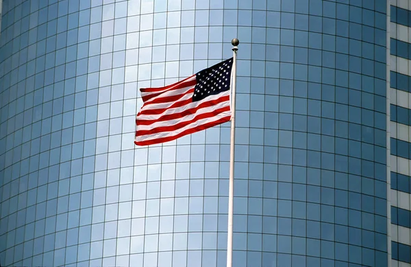 American flag in front of an office building in Manhattan,New York, USA