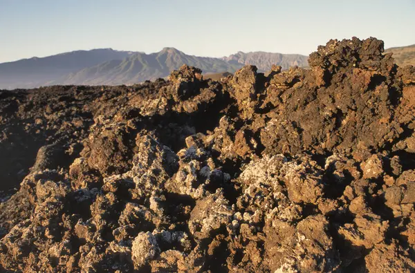 Volcanic rock formation of black lava at sunset on the rocky volcanic island of la Palma, Canary Islands, Spain