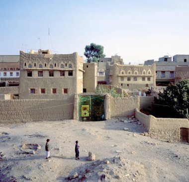 HAJJAH, YEMEN- JUNE 02, 1997: Street scene and houses in the village of Hajjah, Yemen. clipart