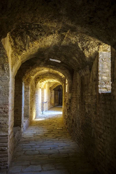 The large corridor under the Italica Amphitheater space dedicated space for distributing spectators throughout the three caveas. Roman city of Italica, located in Santiponce, Seville, Andalusia, Spain.