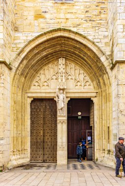 Saint-Jean-de-Luz, France - January 29, 2025: Arched entrance of Saint-Jean-Baptiste Church in Saint-Jean-de-Luz, France. View from Leon Gambetta street. clipart