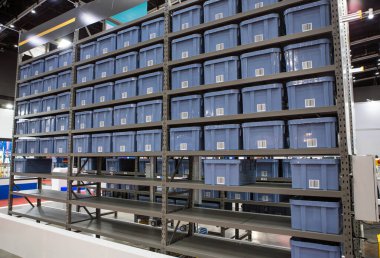 Vertical storage ergonomic solution. Automated storage and retrieval system. Modern industrial warehouse.	