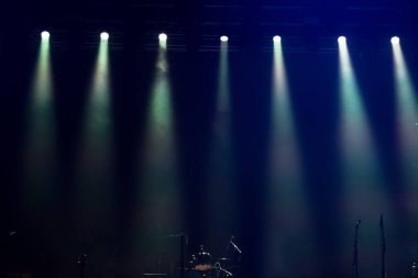Shining stage lights in the dark at concert