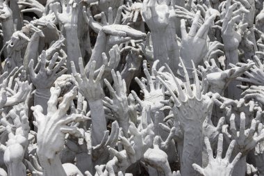 Hands from the Hell at Wat Rong Khun at Wat Rong Khun, Chiang Rai, Thailand.