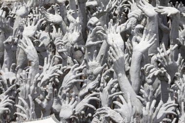 Outreaching Hands at Wat Rong Khun at Wat Rong Khun, Chiang Rai, Thailand.