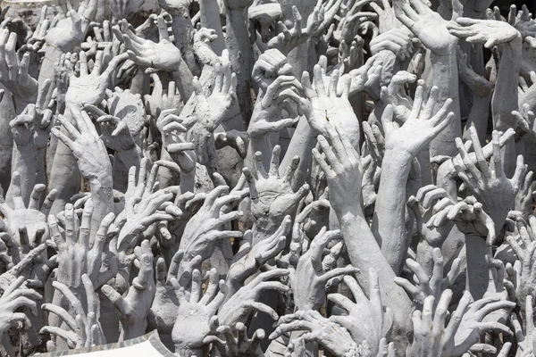 Outreaching Hands at Wat Rong Khun at Wat Rong Khun, Chiang Rai, Thailand.
