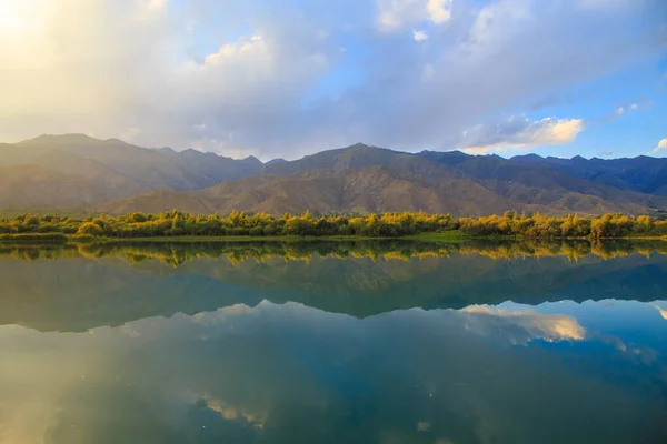 stock image Lake in the mountains. Beautiful nature, reflection of clouds and mountains in blue water. Kyrgyzstan
