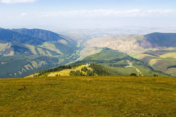 stock image Mountain summer landscape. Snowy mountains and green grass. Peak Karakol Kyrgyzstan.
