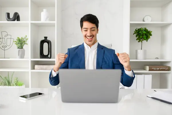 Jovial Hispanic Businessman Celebrates Success Good News His Laptop Sleek — Stock Photo, Image