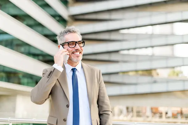 Senior Businessman Light Hearted Conversation His Phone Bright Smile Indicating — Stock Photo, Image