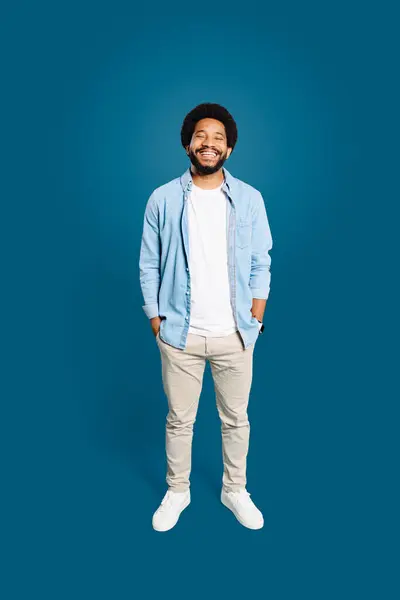Joyful Man Natural Afro Hairstyle Stands Confidently Hands Pockets Casual Royalty Free Stock Photos
