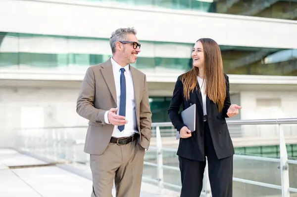 Mature Businessman Grey Hair Young Colleague Both Smile Engage Professional Stock Image